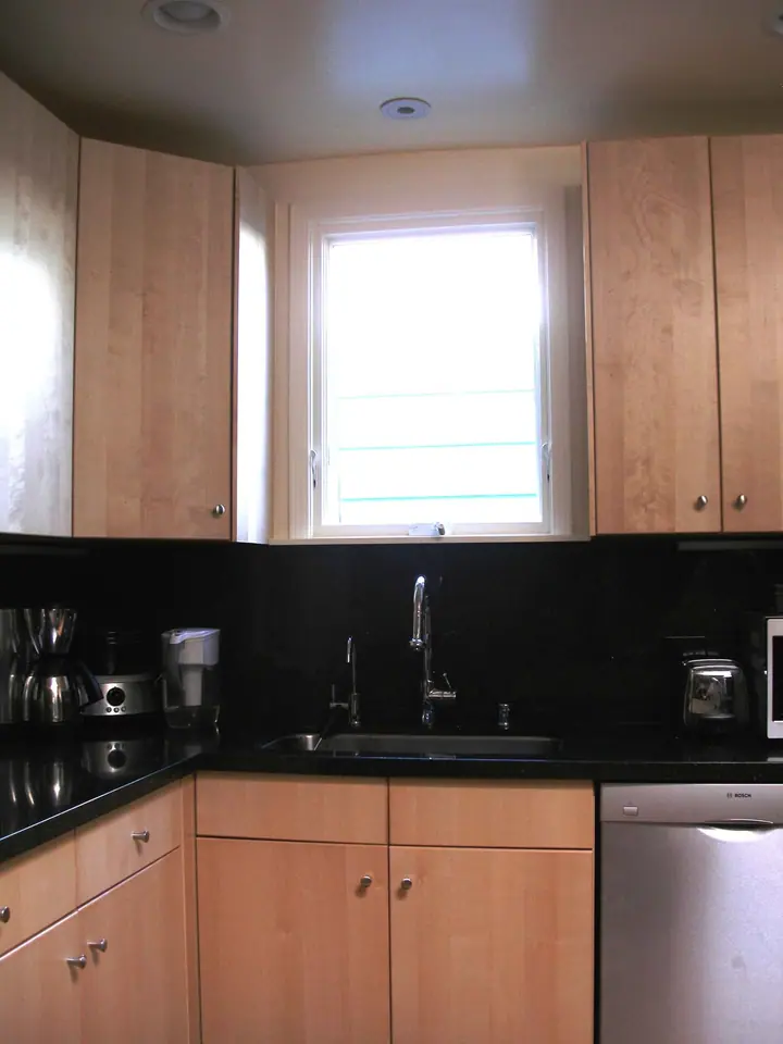 A striking change of style in this complete kitchen remodel: the new look at the kitchen sink