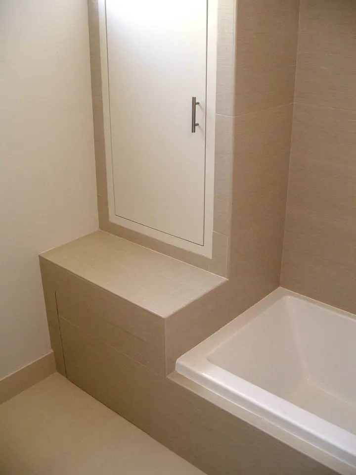 Stylish bath remodel with a floating vanity in the Inner Richmond, San Francisco: base new with a hidden door