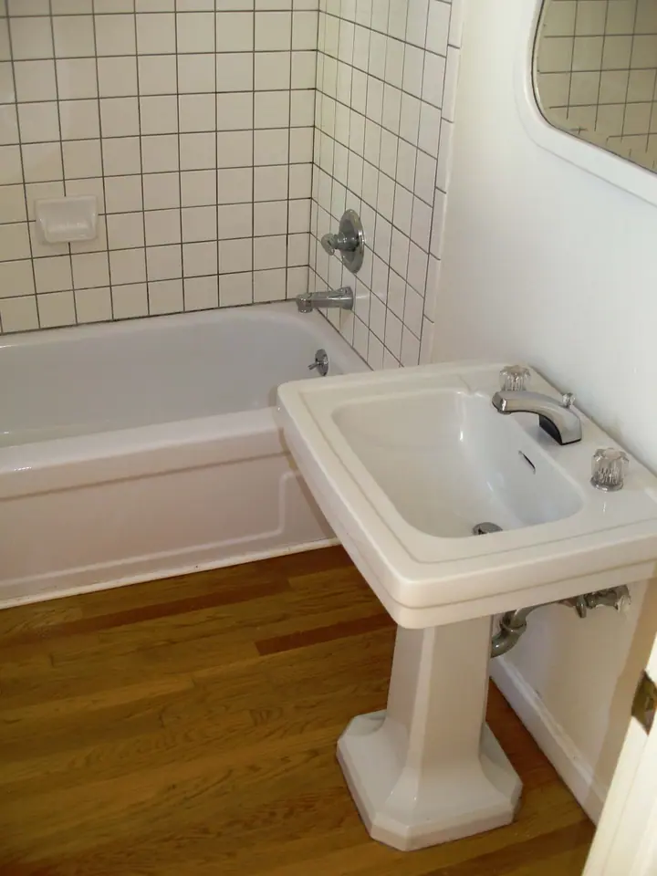Stylish bath remodel with a floating vanity in the Inner Richmond, San Francisco: old vanity to tub