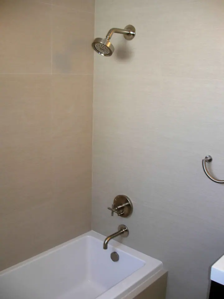 Stylish bath remodel with a floating vanity in the Inner Richmond, San Francisco: valve wall