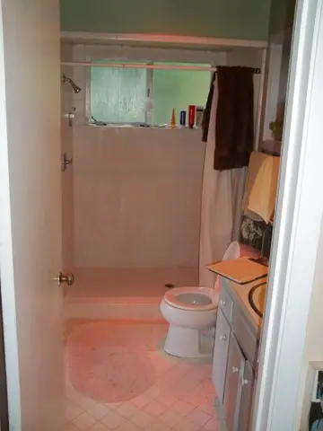 Bath remodel with a custom medicine cabinet: Before from door