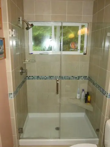 Bath remodel with a custom medicine cabinet: shower wide shot
