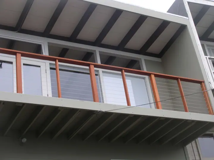 Cable rail system with redwood posts in Twin Peaks, San Francisco: new rail from below