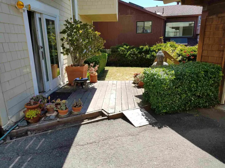 Ground-level deck redo with composite decking: Before from driveway
