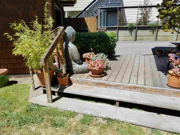 Ground-level deck redo with composite decking: Before step