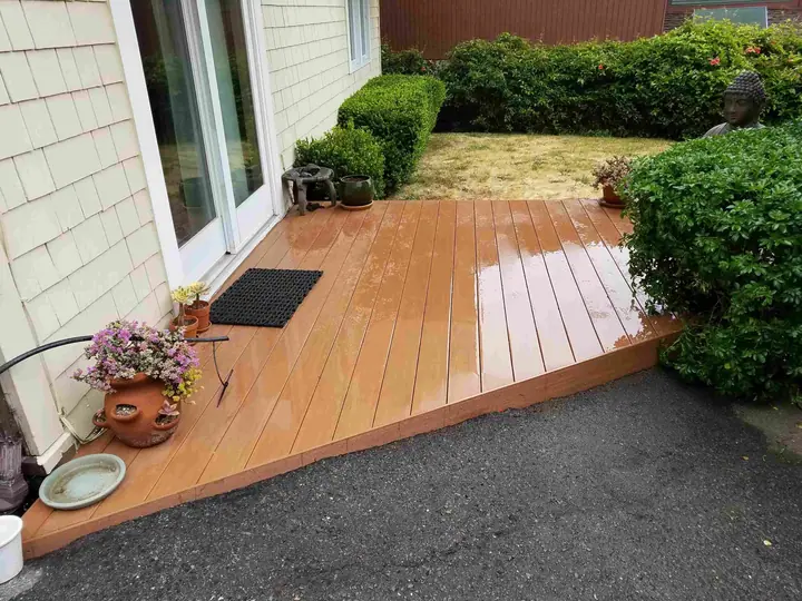 Ground-level deck redo with composite decking: finished deck from drive