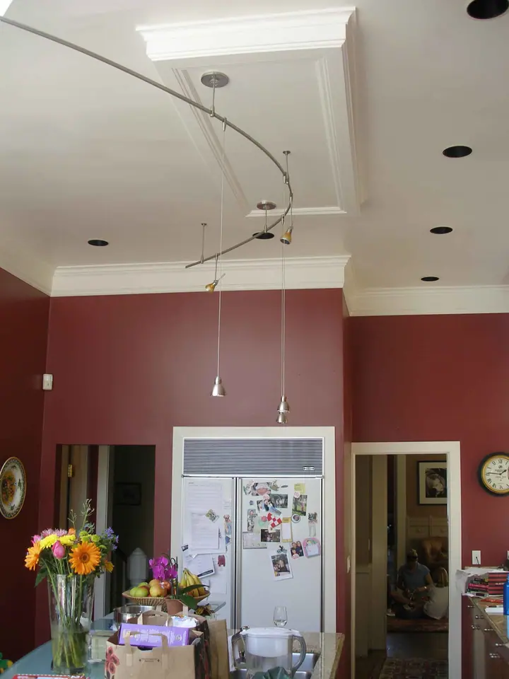 Kitchen and dining bay addition with new island, crown and TV alcove: Before fridge wall
