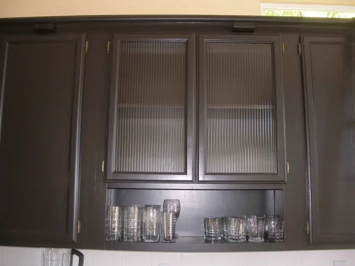 Kitchen reorientation remodel with special features in Petaluma: glass door upper