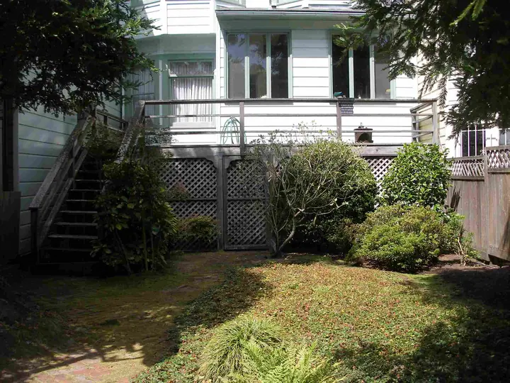 Redwood deck rebuild and expansion in the Inner Richmond, San Francisco: Before deck from the yard