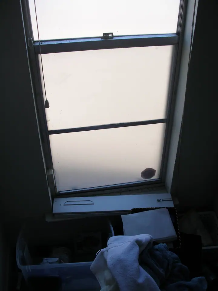 Penthouse primary bath reorientation with glass tile in Oakland: Before mast bth window east end