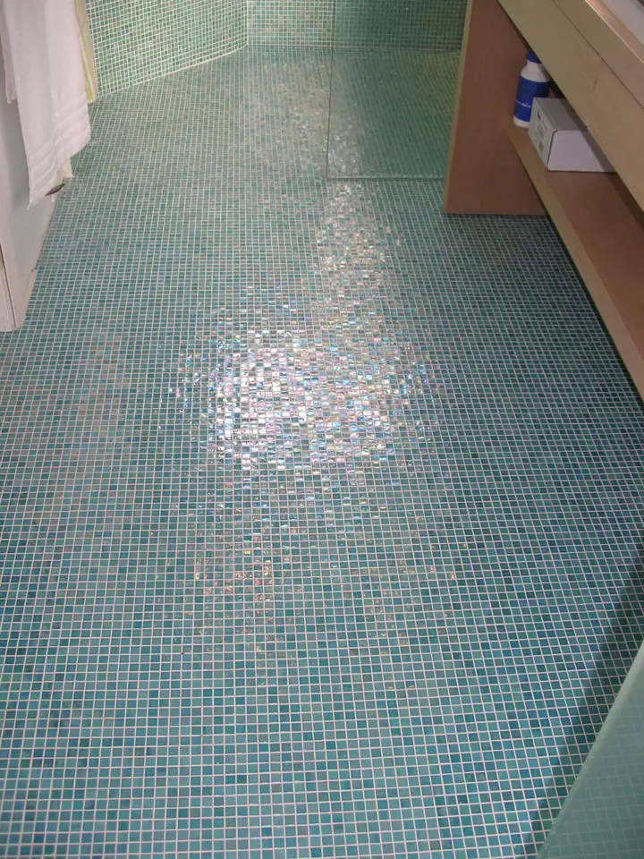 Penthouse primary bath reorientation with glass tile in Oakland: floor into the sho0wer