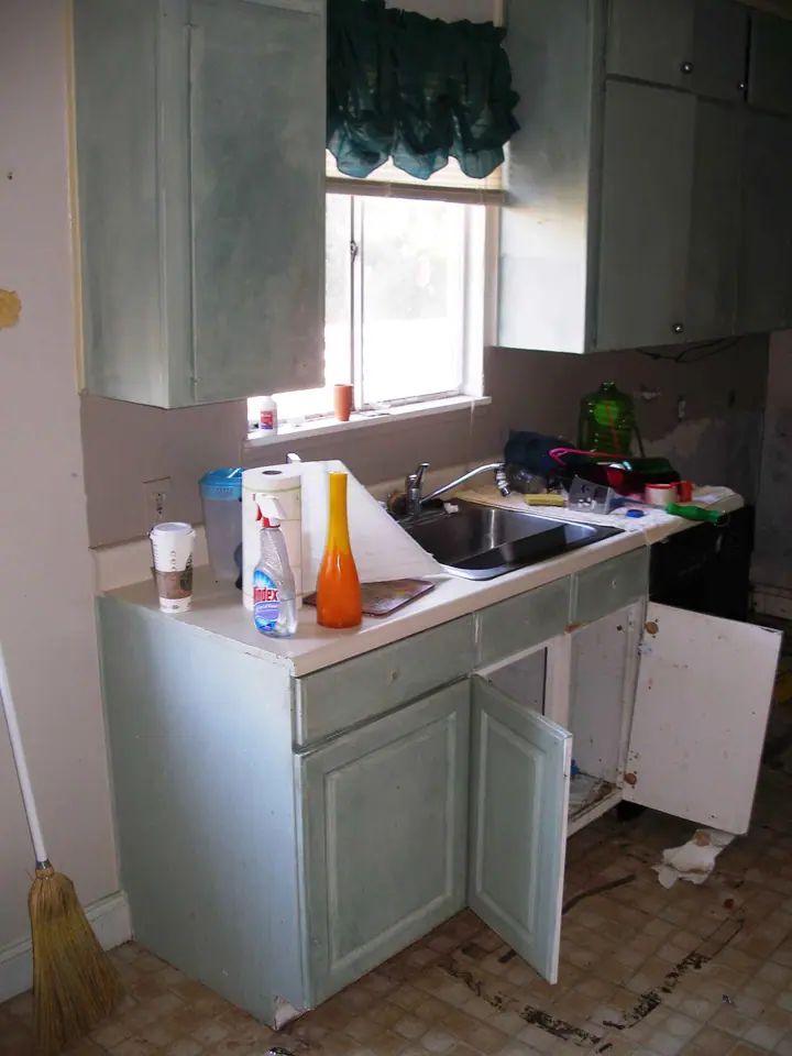 Rental kitchen that was in bad shape, Novato: Before sink wall