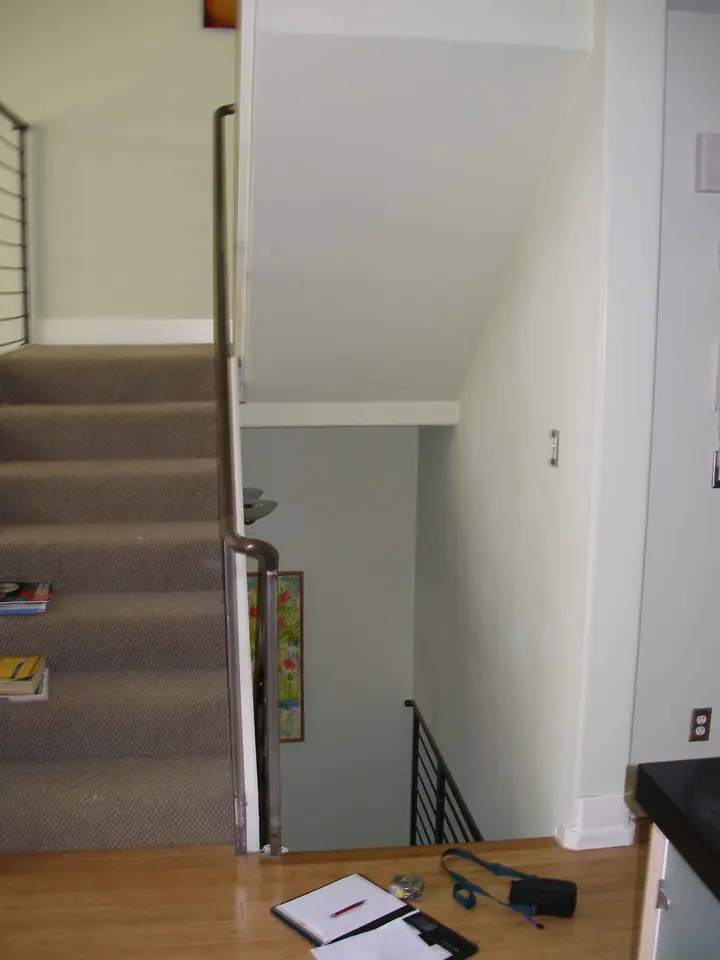 Retrofit wall to isolate an open stairway for privacy, Mission District, San Francisco: head on wide
