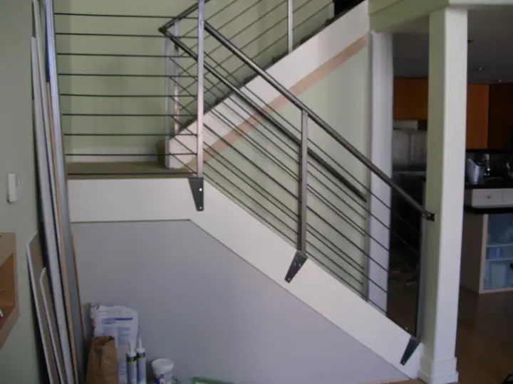 Retrofit wall to isolate an open stairway for privacy, Mission District, San Francisco: finished wall from the side