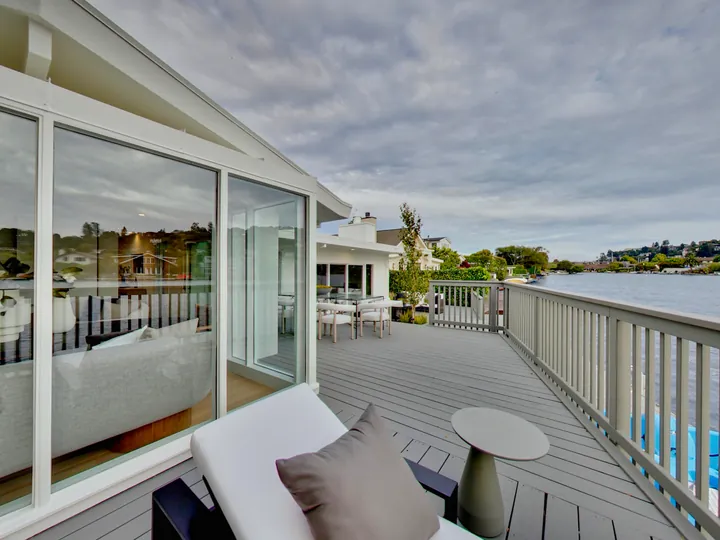 Deck with a railing along the water